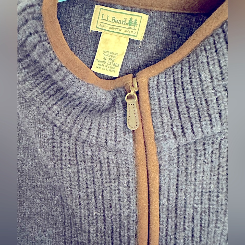 Blue quarter-zip thick wool sweater.